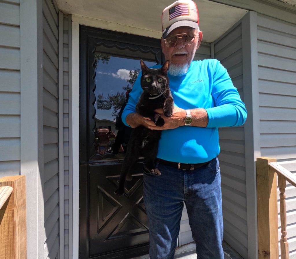 black cat and man