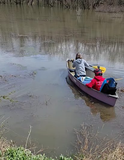 Cat rescuers in canoe